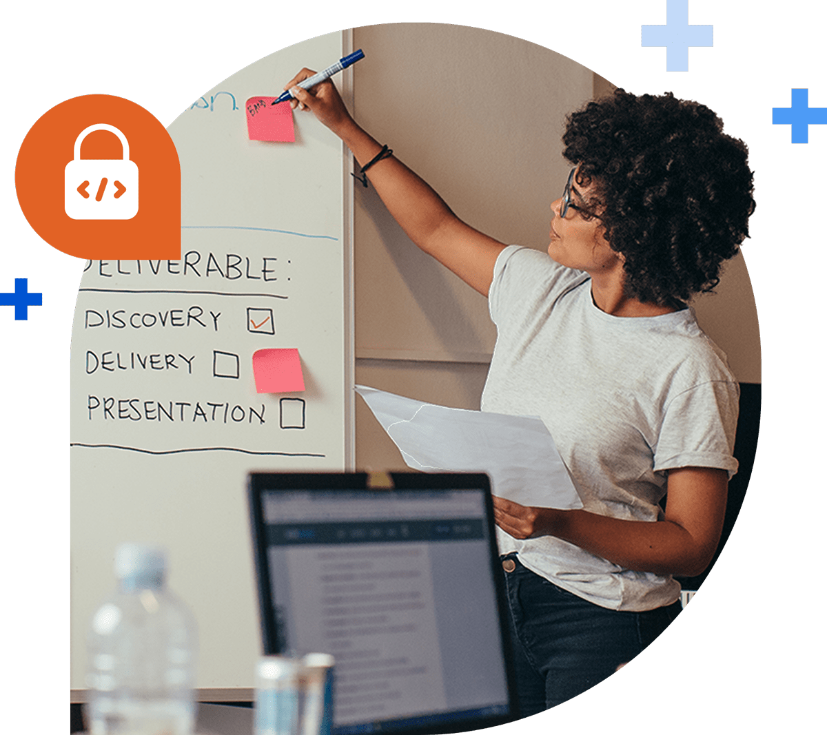 an african-american woman at a whiteboard walking through a product roadmap strategy